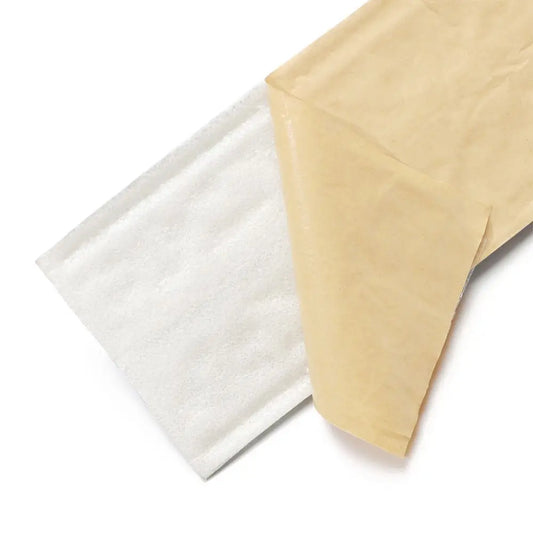 Adhesive back of the strip: the beige protective paper peels off the white foam
