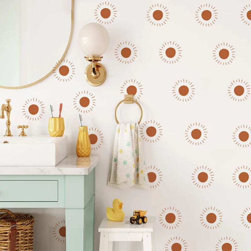 Bathroom with a basin and wall decorated with orange sun stickers