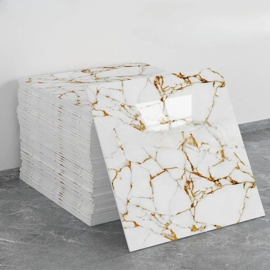 Pile of self-adhesive marble effect panels in white with golden veins and a panel leaning against it
