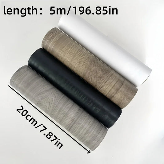 Four rolls of wood effect adhesive moulding in white, brown, black and grey, 20 cm wide