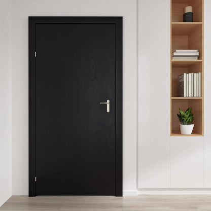 Black door next to a shelving unit in a bright room