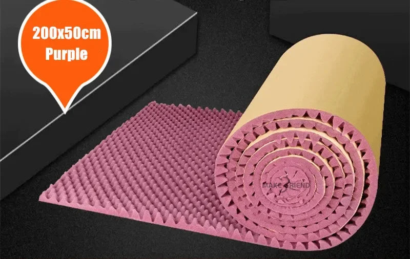 Roll of purple acoustic foam, with a mauve-pink tinge, and a kraft paper back