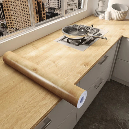 Kitchen worktop covered in light wood effect self-adhesive vinyl