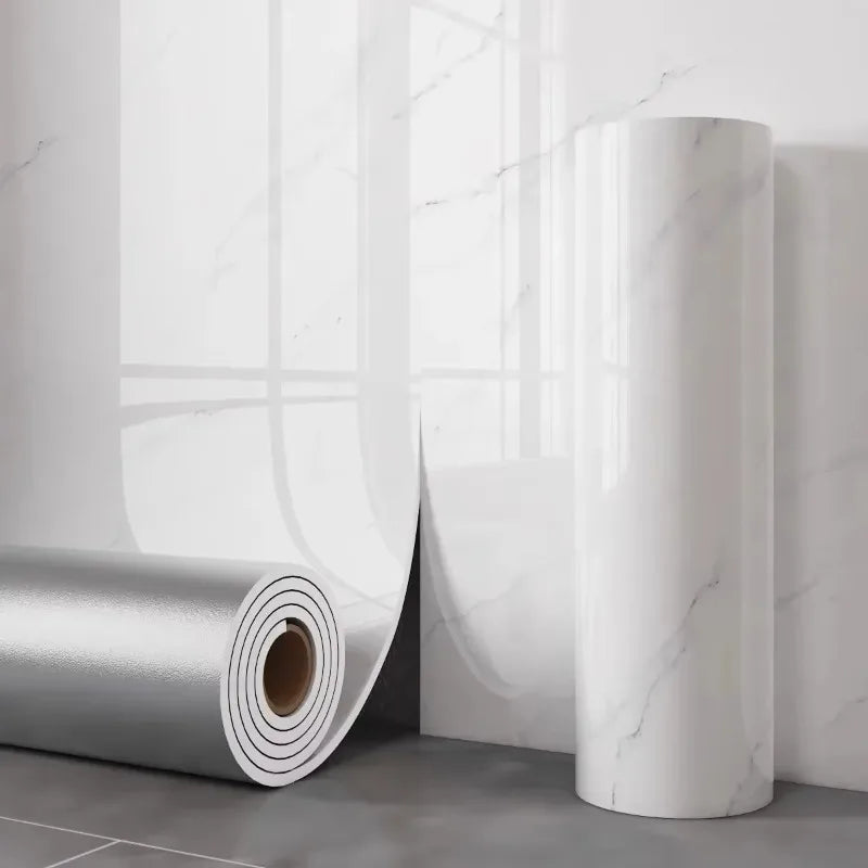 White marble effect panel: unrolled roll with aluminium back and a roll standing upright