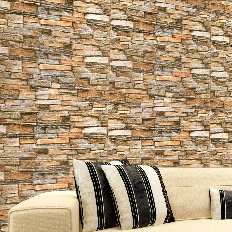 Wall with brown and orange stone effect behind a sofa with striped cushions