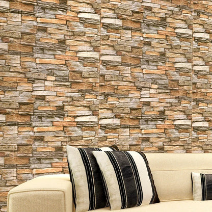 Wall with brown and orange stone effect behind a sofa with striped cushions