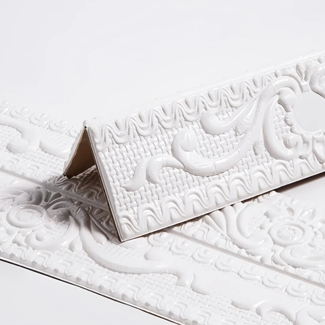 White self-adhesive moulding with raised decoration, folded in a V on a white background