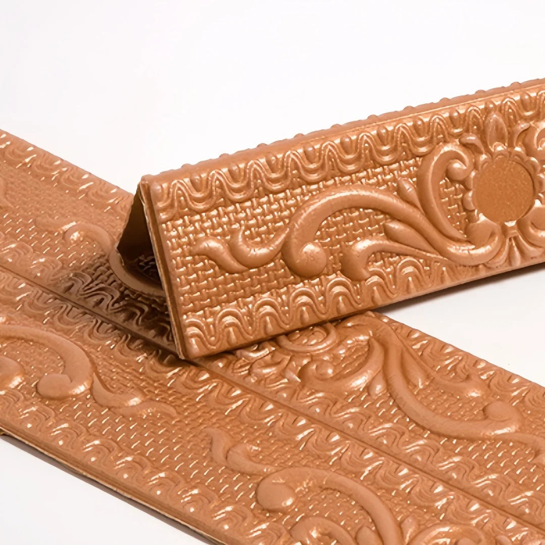 Copper self-adhesive moulding with raised decoration, folded in a V