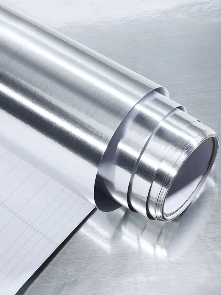 Roll of silver vinyl with the white grid backing visible at the edge