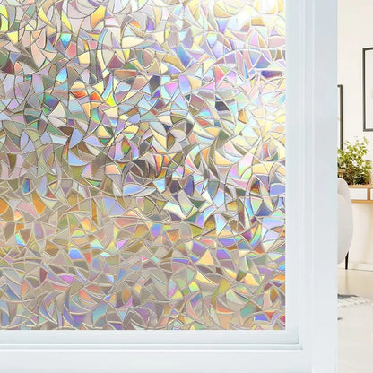Glass of a window with static crystal film that creates rainbow reflections
