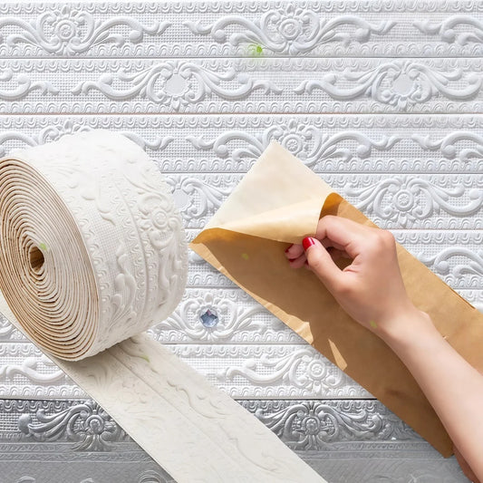 Hand peeling the paper from the back of an embossed decorative self-adhesive strip
