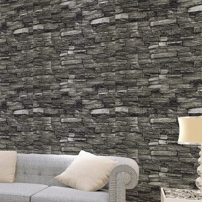 Wall with dark grey stone effect behind a grey sofa