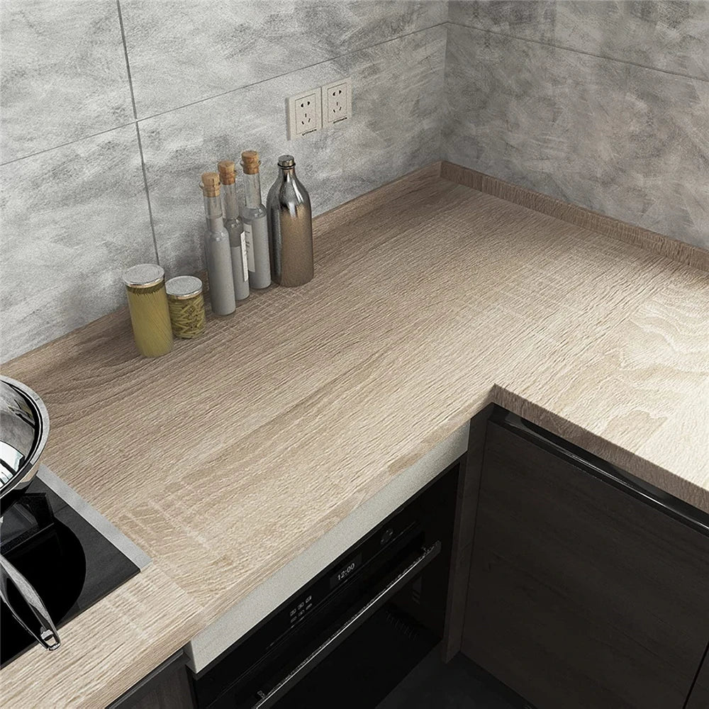 Corner worktop covered in wood effect vinyl