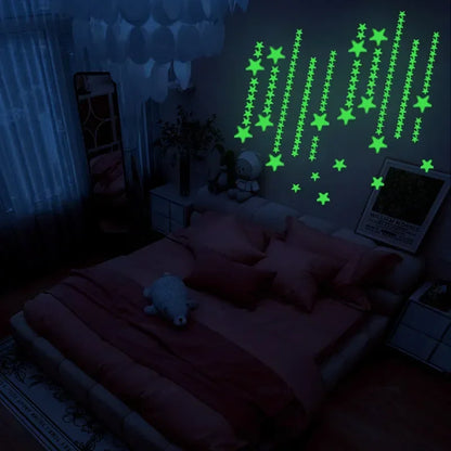 Dark bedroom with rows of glow in the dark stars on the wall above the bed