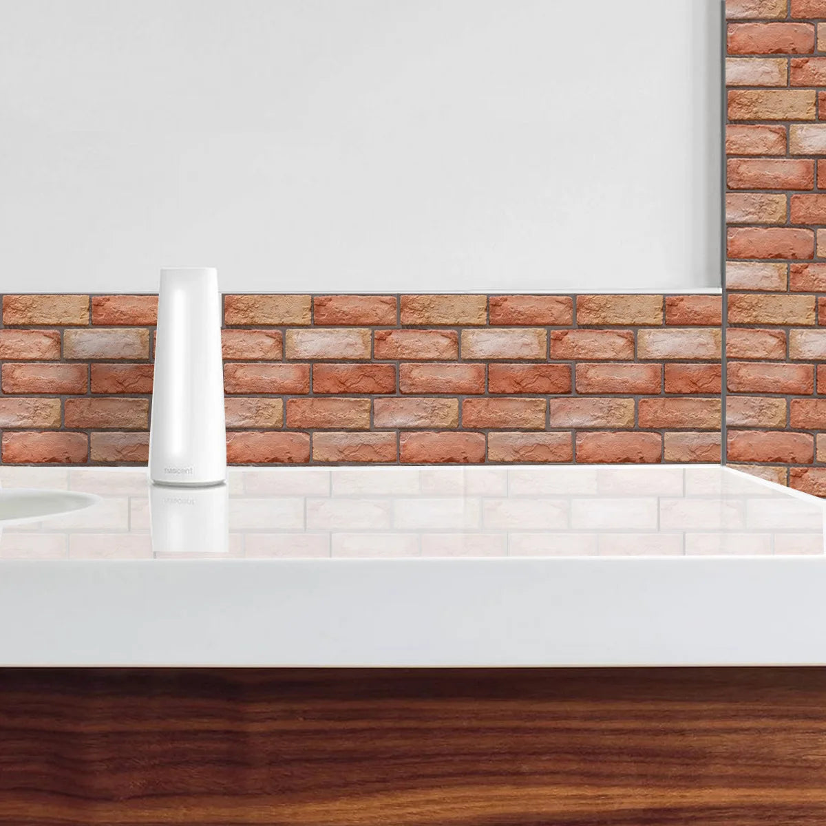 Wall of red brick effect panels above a white worktop with a vase