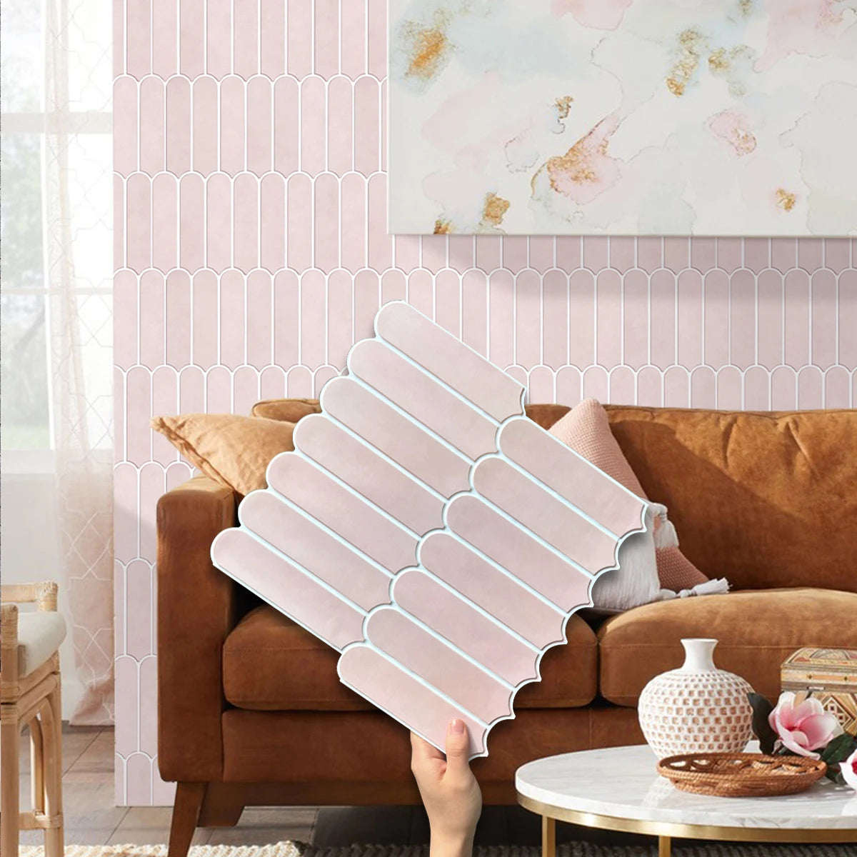 Living room with a dusty pink wall and a dusty pink sheet lifted in front of the sofa