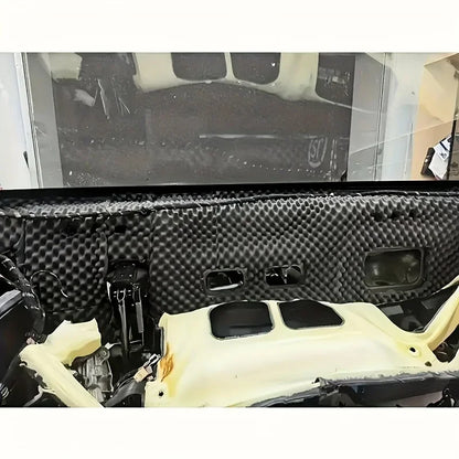 Car cabin lined with black self-adhesive acoustic foam