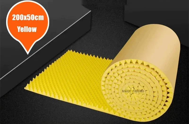 Roll of yellow acoustic foam with round bumps and a kraft paper back