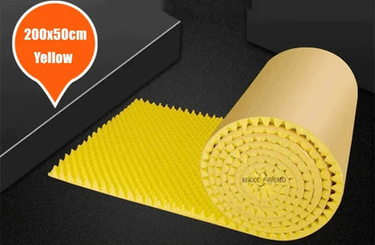 Roll of yellow acoustic foam with round bumps and a kraft paper back