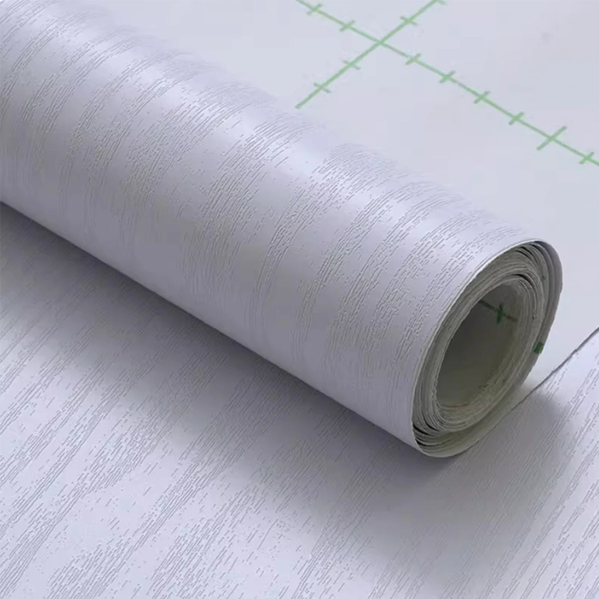 Roll of white wood effect self-adhesive vinyl with grey grain