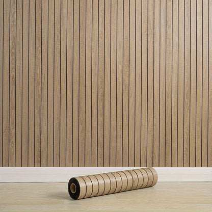 Wall covered with a panel with vertical black stripes and a roll resting on the floor