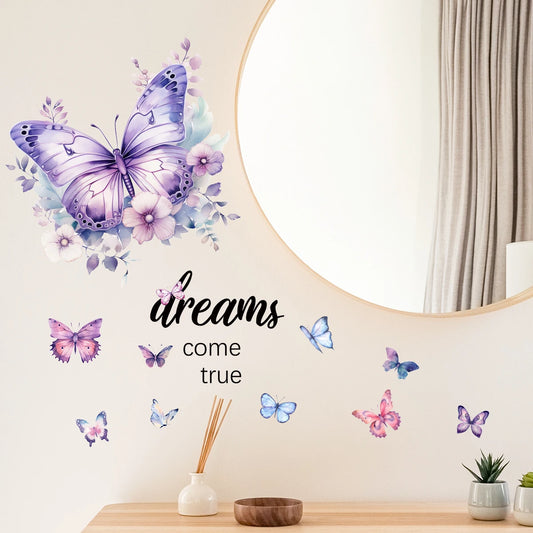 Seinätarra, jossa violetti perhonen ja teksti ”dreams come true”, pyöreän peilin ja konsolipöydän vieressä