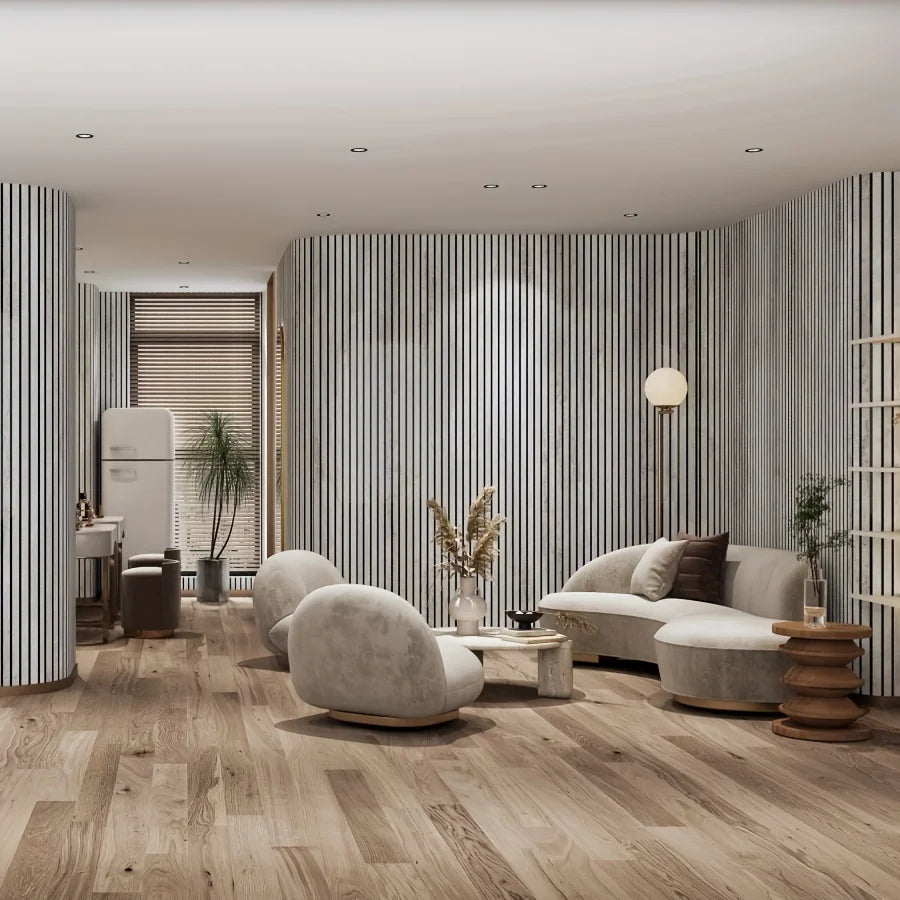 Living room with a curved wall covered with grey slat panels