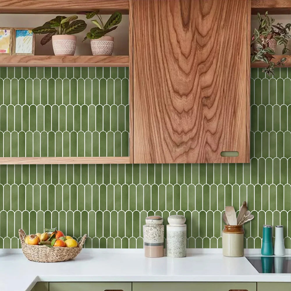 Kitchen with a green wall covered in adhesive panels with rounded elements, with wooden shelves
