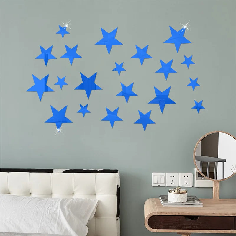Blue five-pointed stars on a pale green wall above a bed