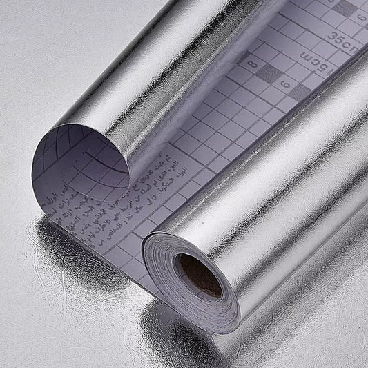 Roll of plain silver adhesive vinyl with the grid-printed protective sheet on the back