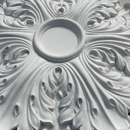 Close-up of the central hollow and the leaf relief of the ceiling rose