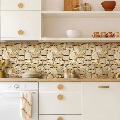 Kitchen wall above the worktop clad with brown stone effect adhesive panels