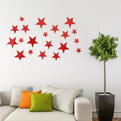 Red five-pointed stars on a white wall above a sofa