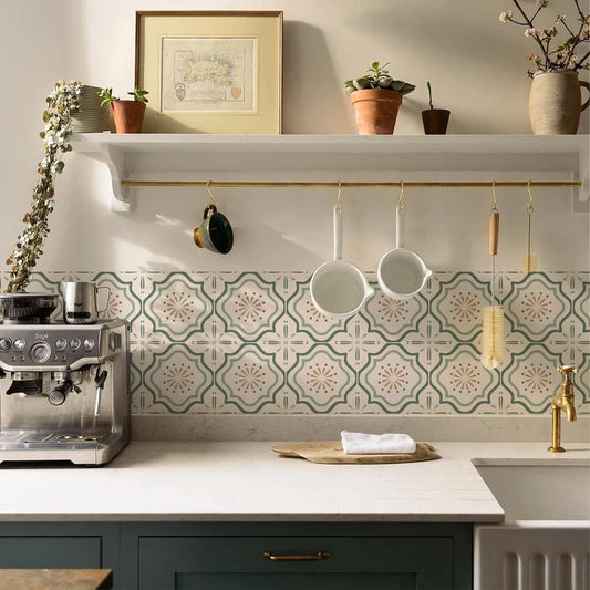 Kitchen with a strip of green and cream tile stickers behind the worktop