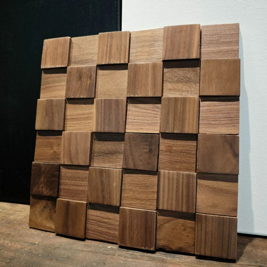 Wood mosaic panel leaning on a dark wall: the offset and the thickness can be seen