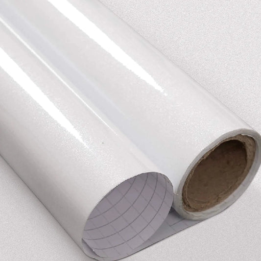 Two rolls of glossy white adhesive vinyl with the grid paper on the back