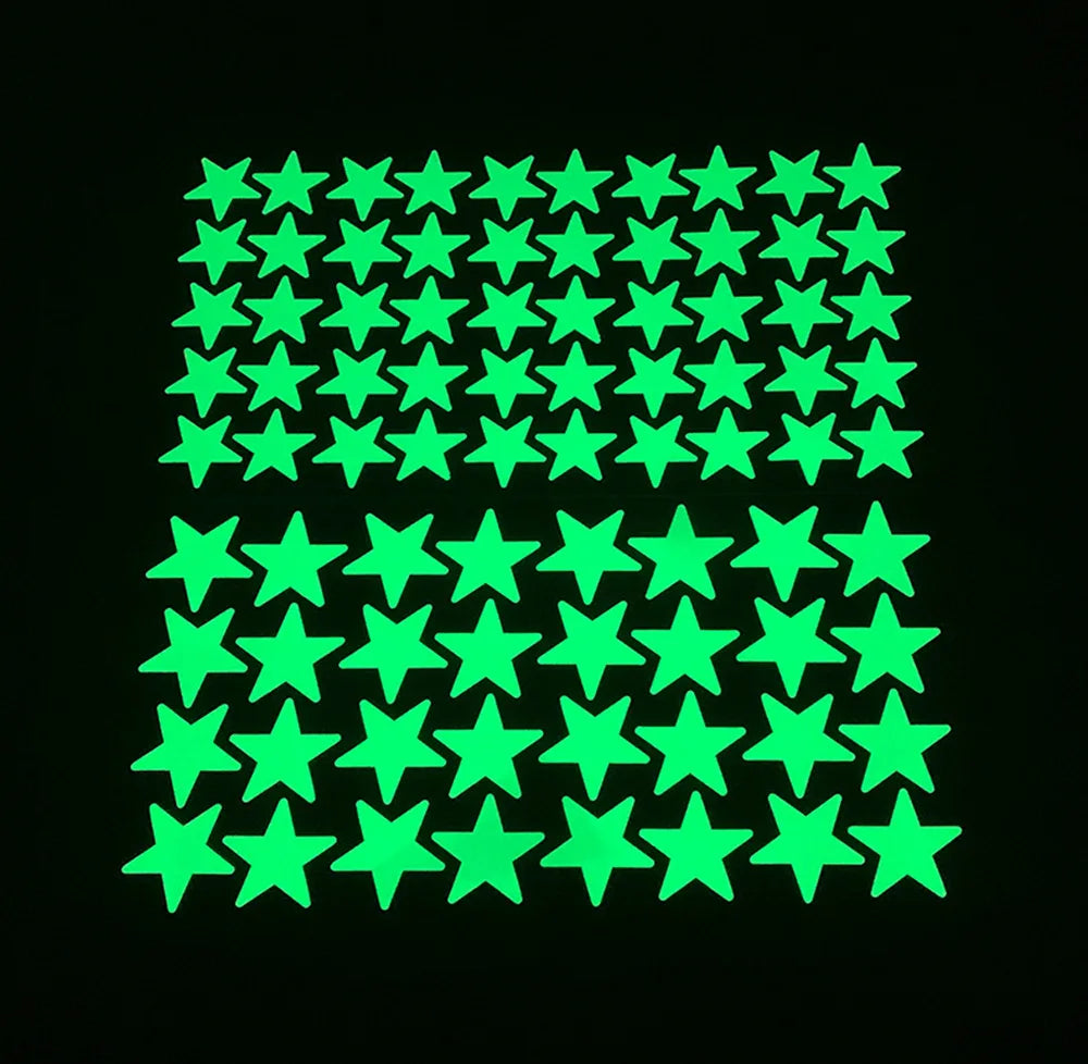 Glow in the dark stars of two sizes arranged in a grid on a black background