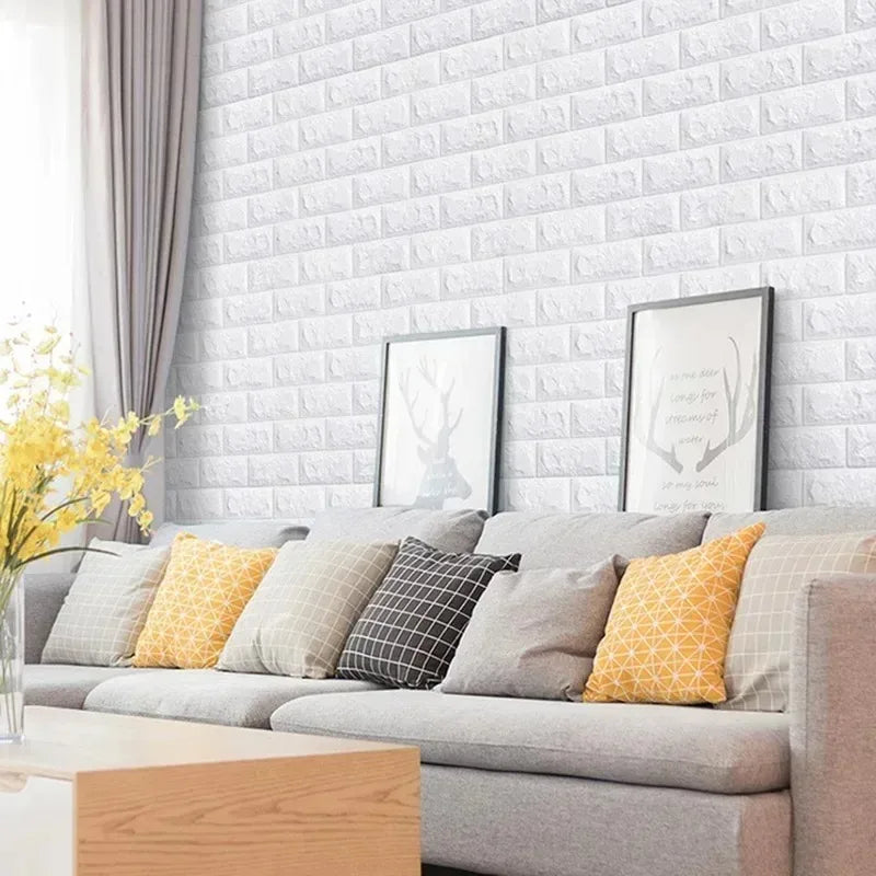Wall of raised white bricks behind a sofa with coloured cushions