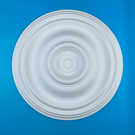 Round white polyurethane ceiling rose with relief of concentric circles, seen from above