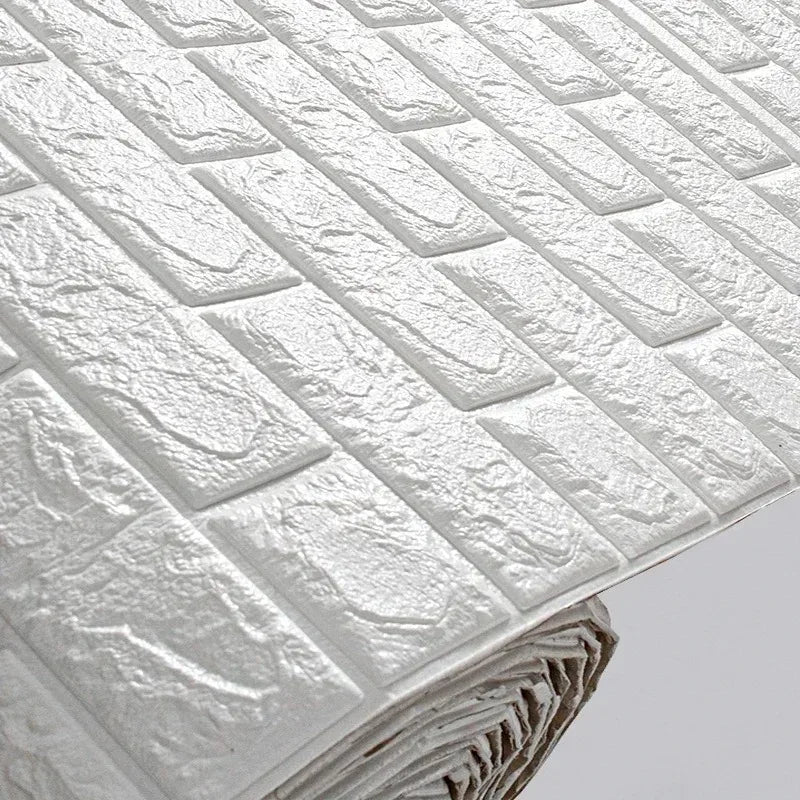 Close-up of raised white bricks on a roll of self-adhesive foam wallpaper