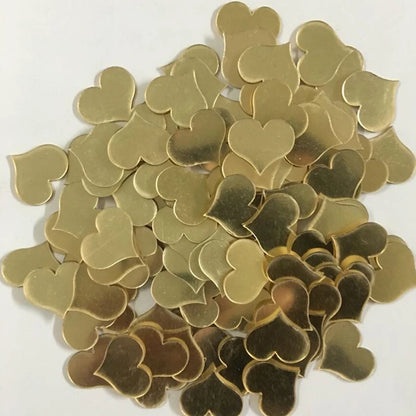 Stapel gouden hartvormige plakspiegels