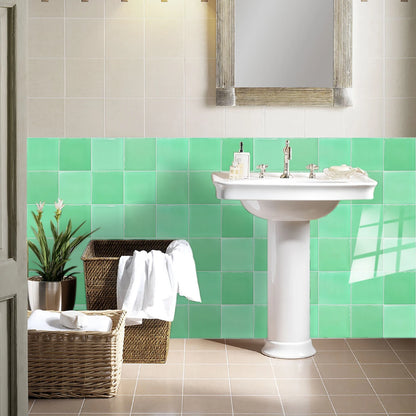 Bathroom with pedestal washbasin and a strip of green gradient tile stickers