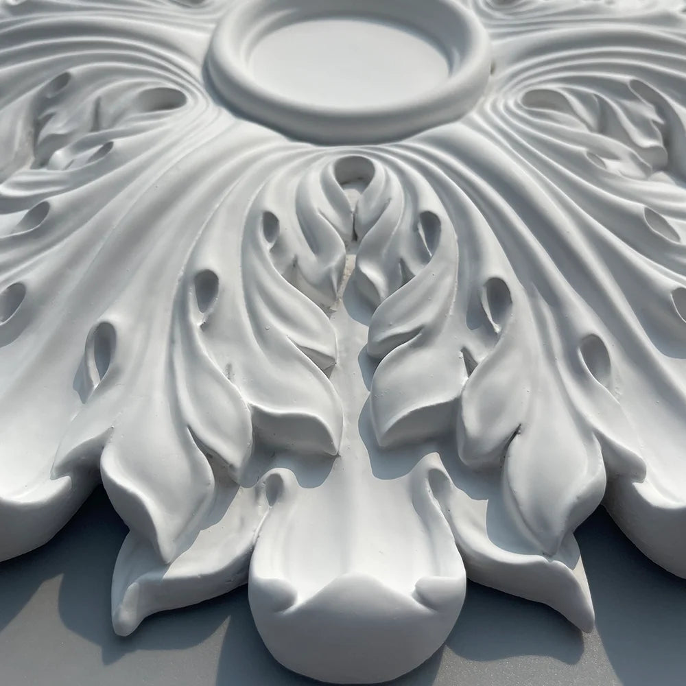 Close-up of the leaf relief and the lobed edge of the ceiling rose