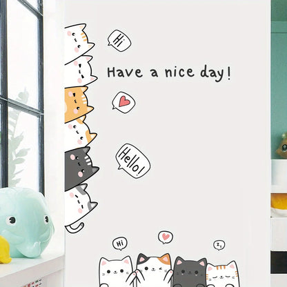 Close-up of cartoon cats with speech bubbles and “Have a nice day!” applied to a white wall