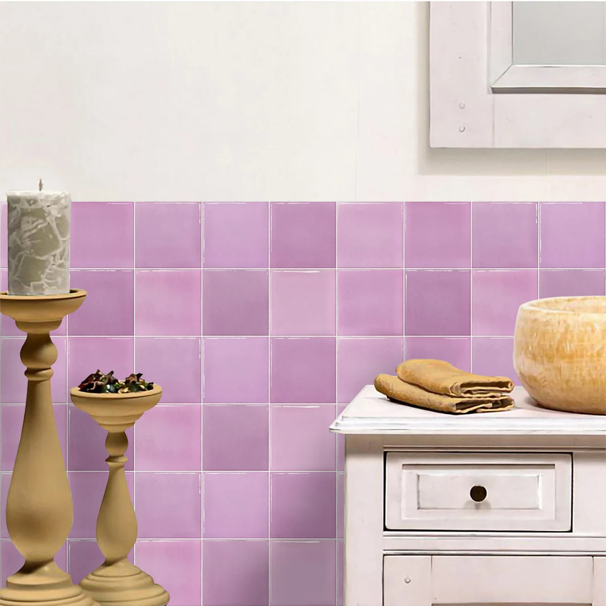White cabinet and candlesticks in front of a wall of lilac gradient tile stickers