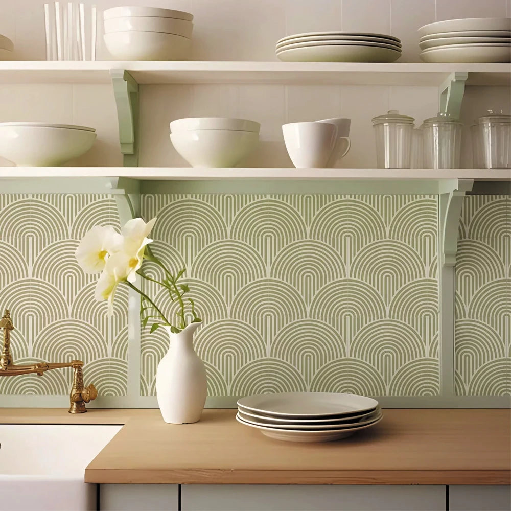 Kitchen splashback with olive green arch stickers under the shelves, with plates and a vase of flowers