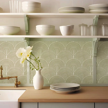 Kitchen splashback with olive green arch stickers under the shelves, with plates and a vase of flowers