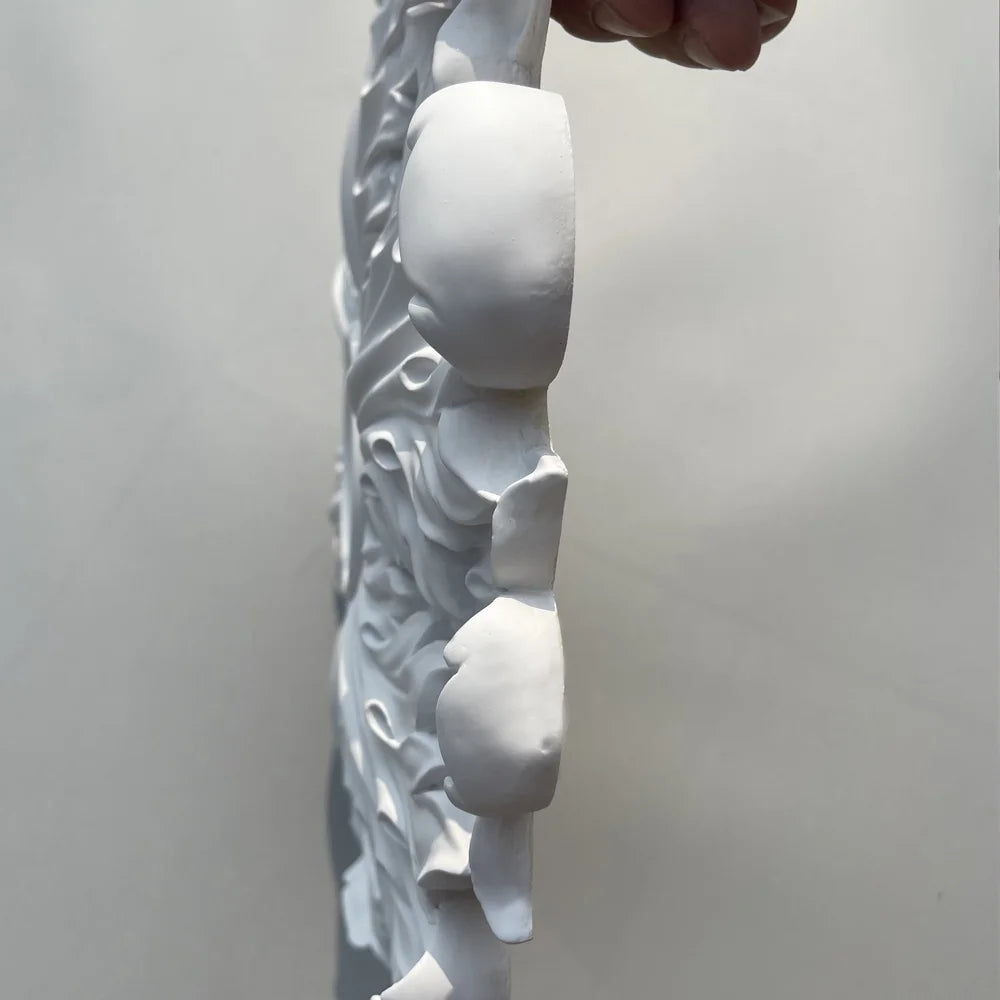 Ceiling rose seen in profile, showing the thickness of the relief