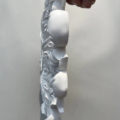 Ceiling rose seen in profile, showing the thickness of the relief