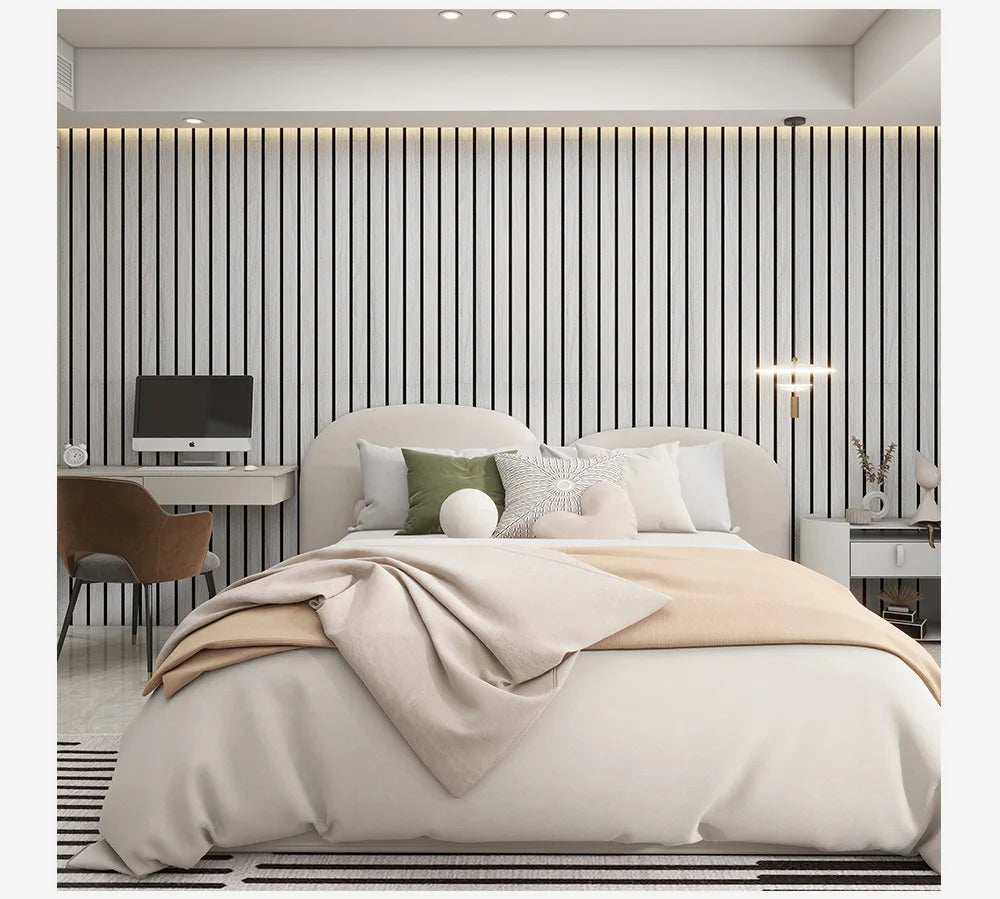Bedroom with light wood effect wall with black lines behind the bed